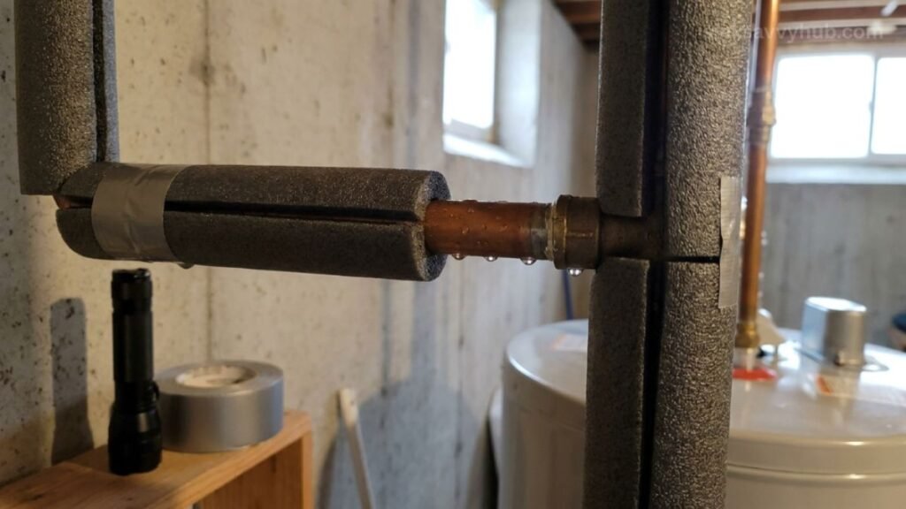 foam pipe insulation under kitchen sink Wrapping cold metal water supply lines with black foam insulation tubes to stop under-sink pipe condensation