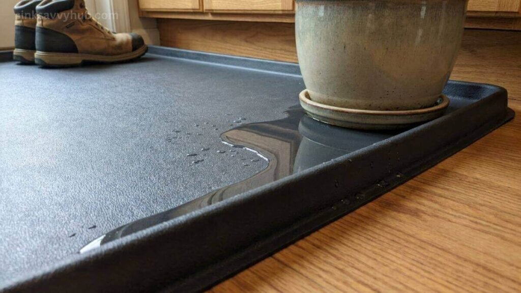 A thick PVC waterproof mat with raised edges designed to protect the under kitchen sink cabinet floor